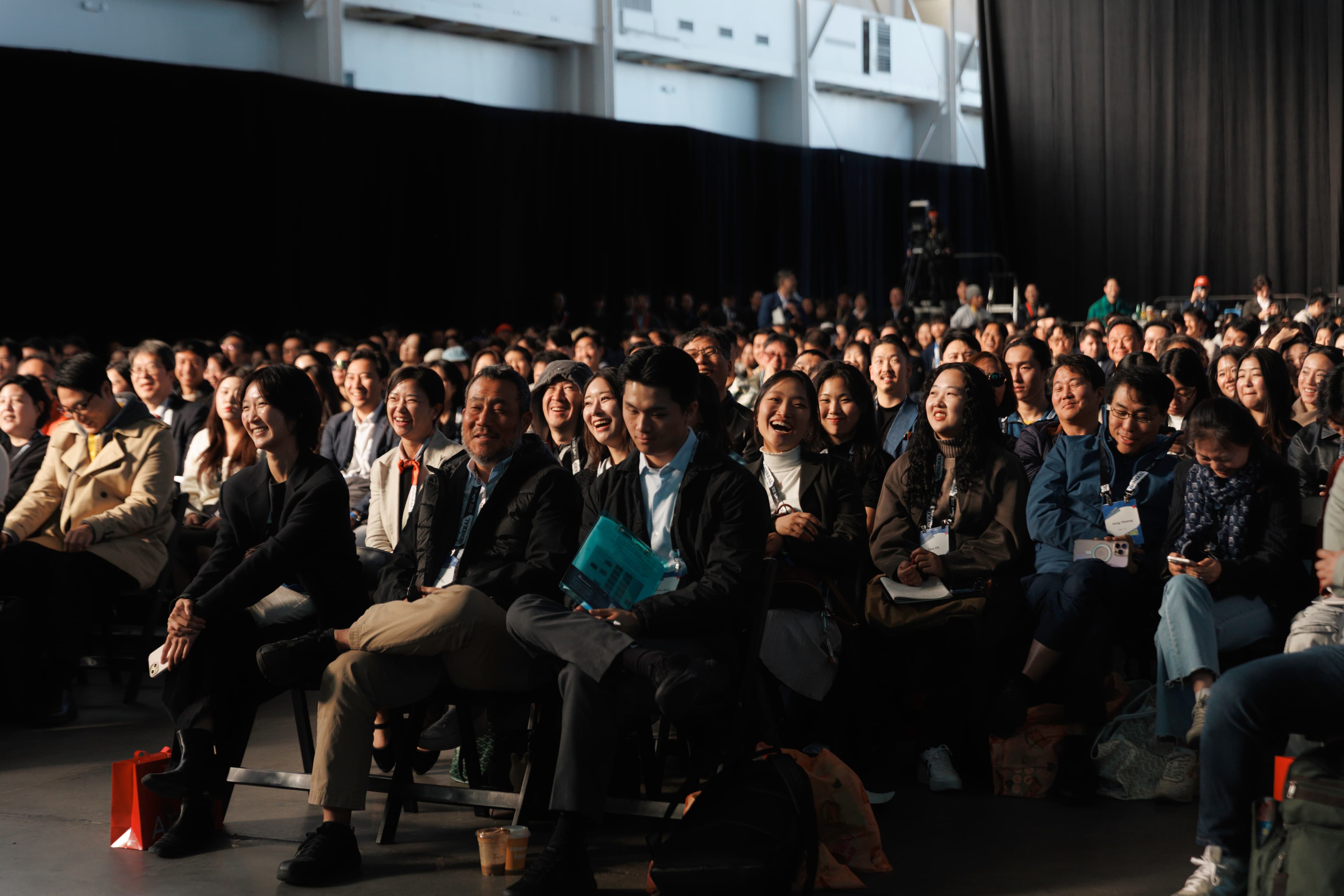 Audience seated for KOOM Stage daytime sessions